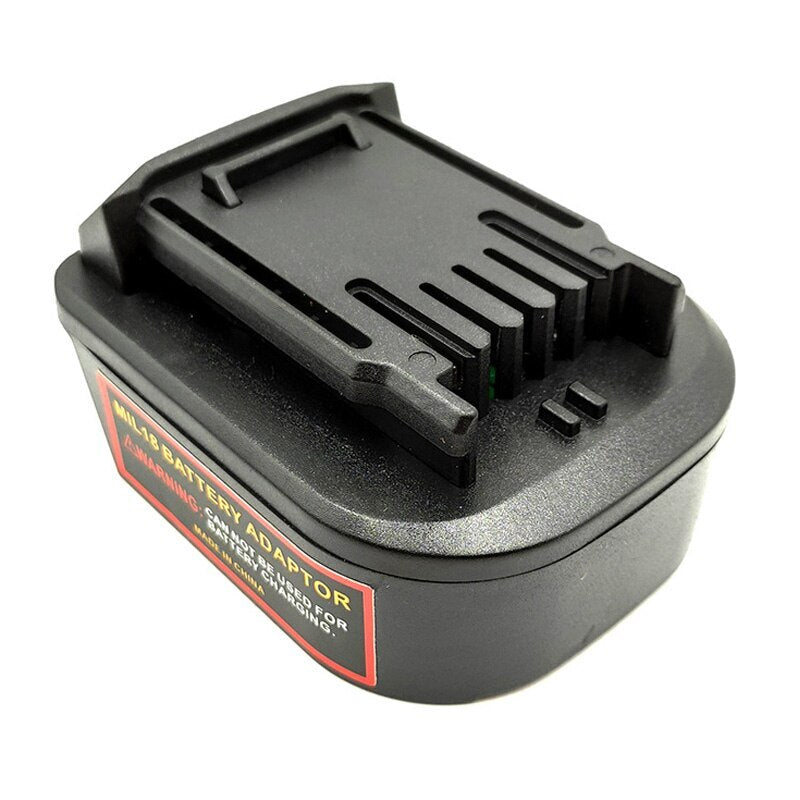 Milwaukee M18 to CAT 18V battery adapter - CAT tool-side connection in three-quarter view, warning label on the body side